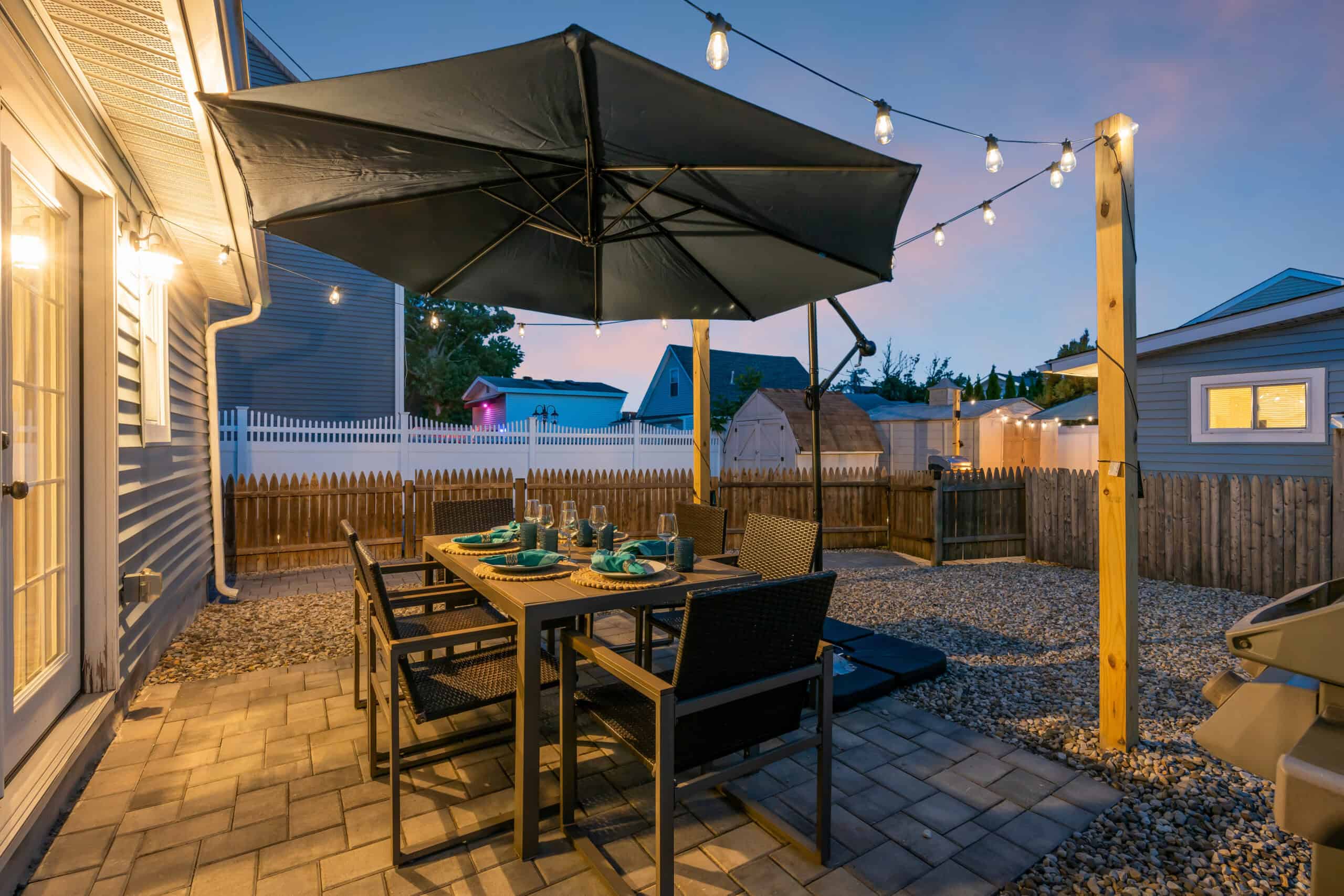 A Shore Thing vacation rental exterior patio with string lights - Belmar, NJ