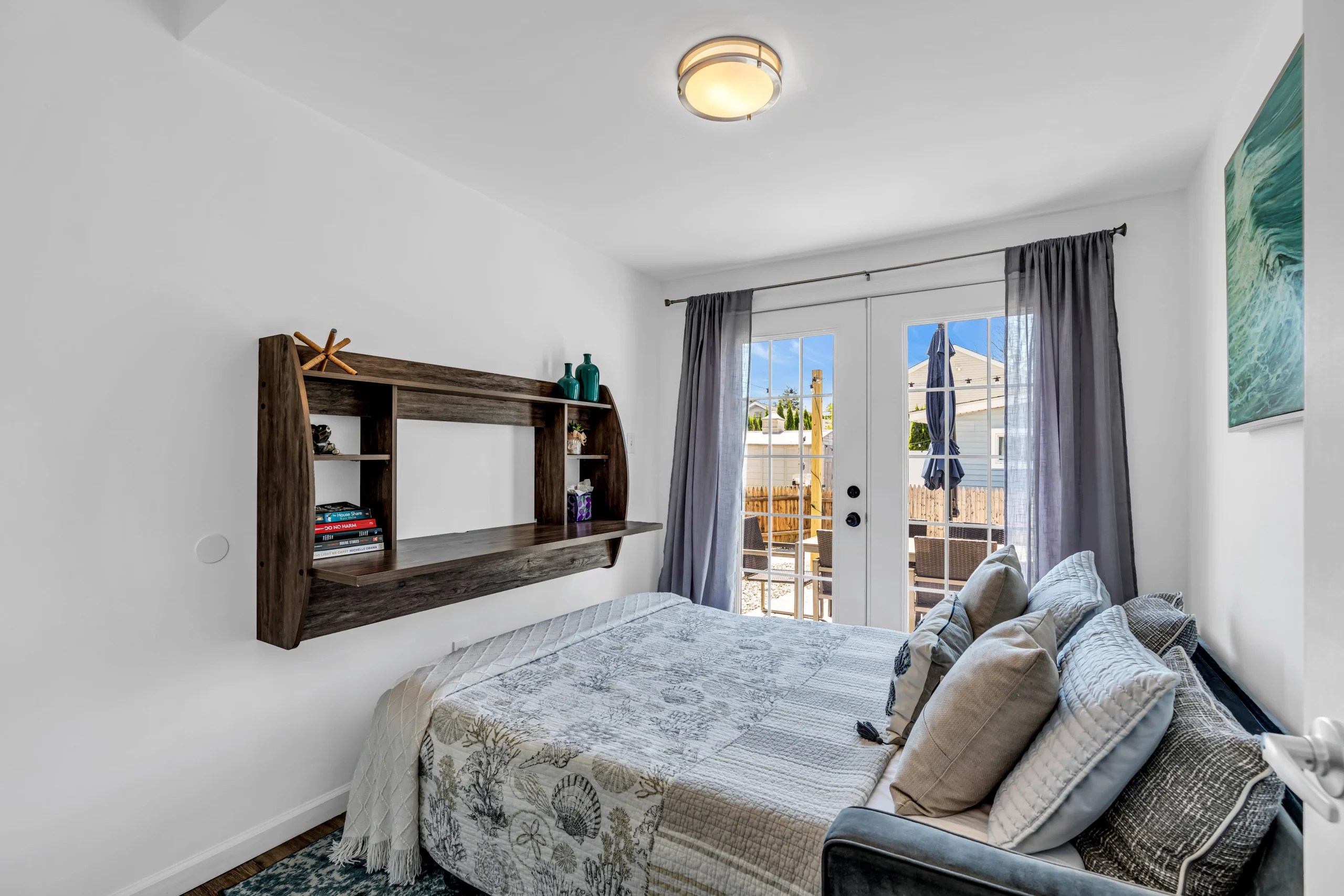 Coastal Belmar rental bedroom with patio doors, kept guest ready by an Airbnb co host
