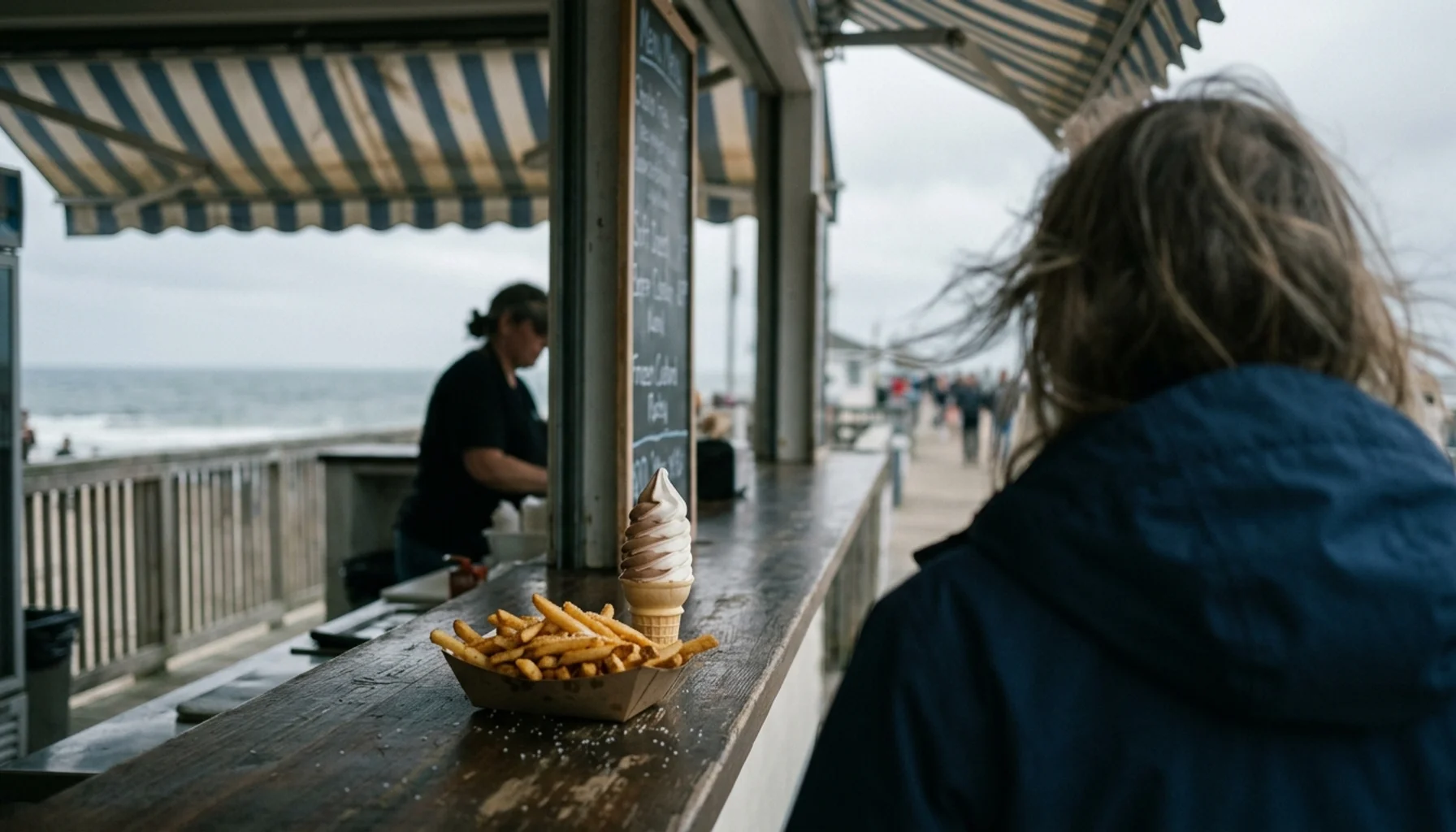 Classic boardwalk foods like fries and frozen custard displayed at a Jersey Shore boardwalk stand