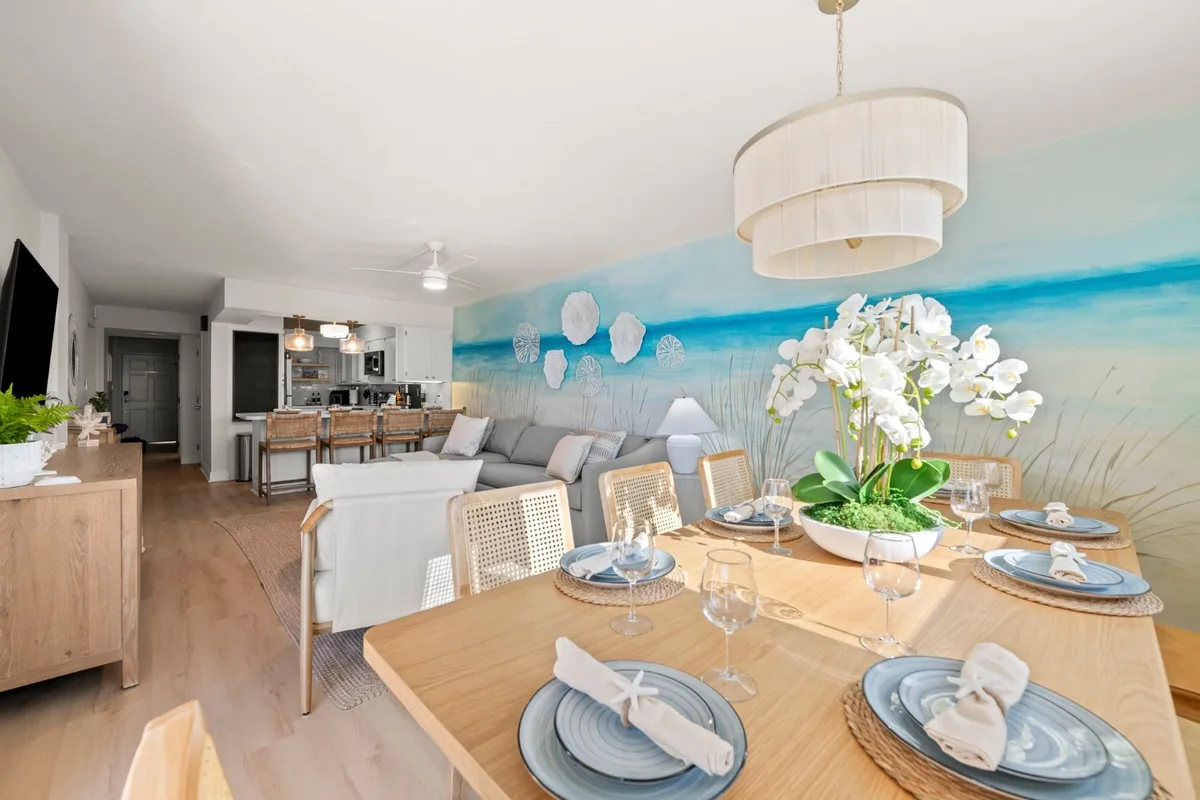 Dining area with a beach mural at a client home in Panama City Beach, FL