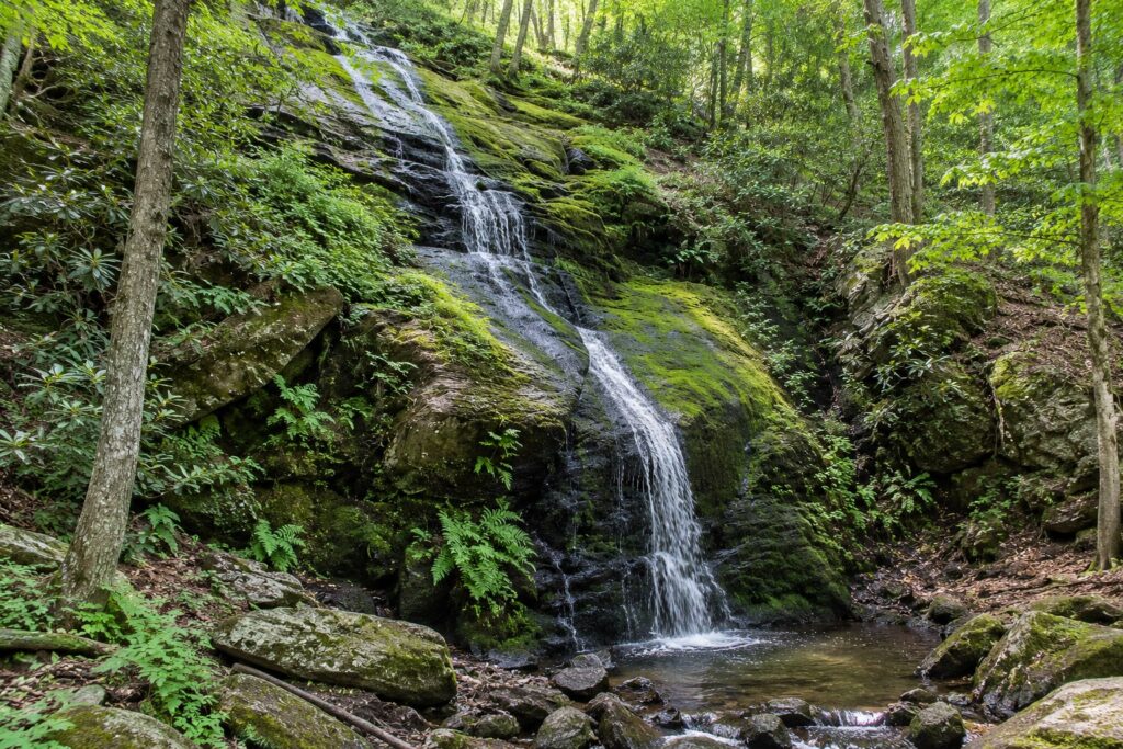 Buttermilk Falls spilling down layered rock