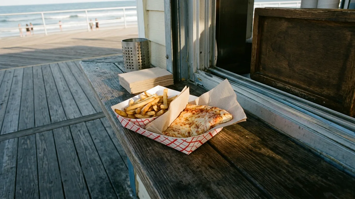Classic Jersey Shore boardwalk foods including fries and pizza slice