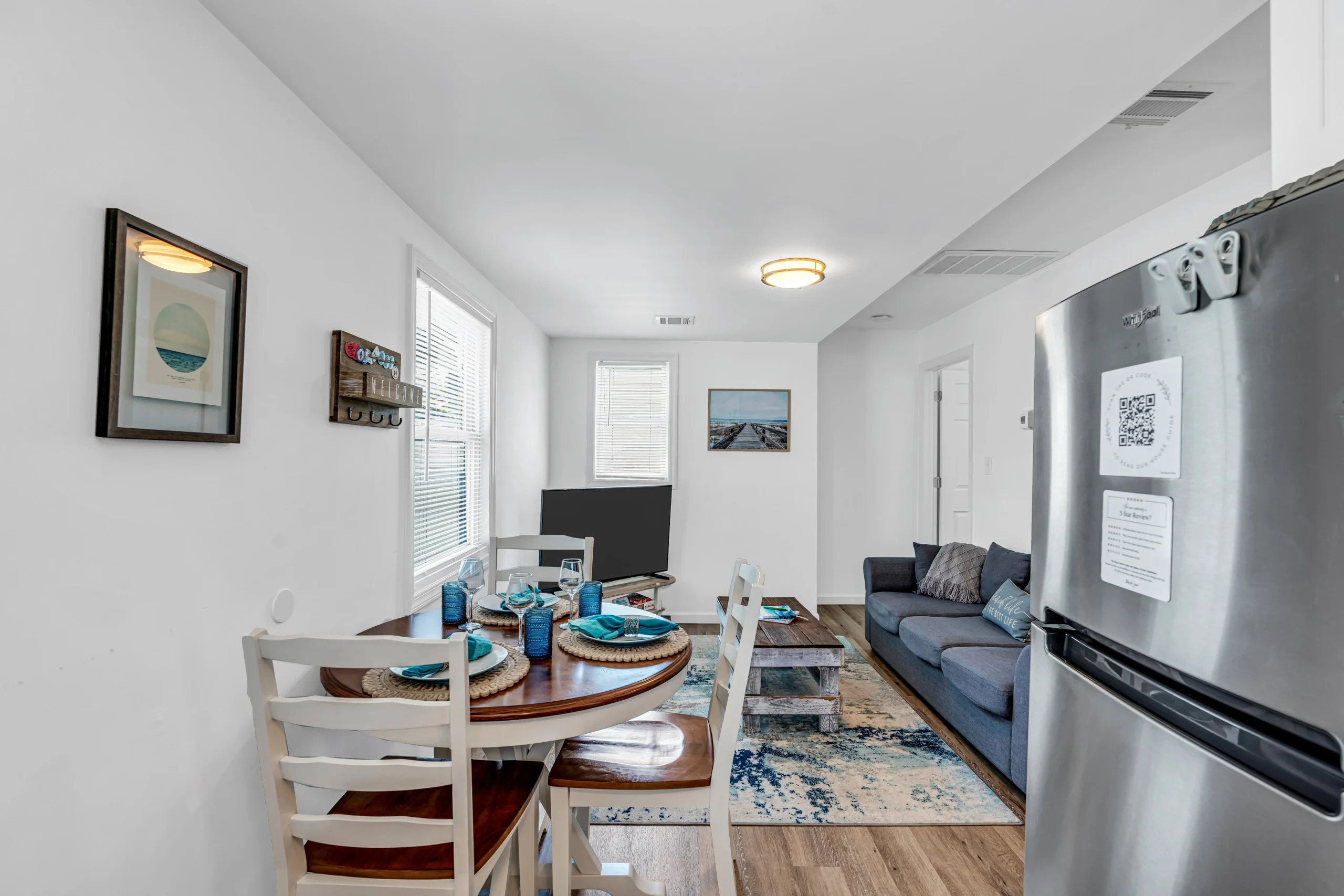 Coastal living room with dining area and ocean view windows in Belmar summer rental