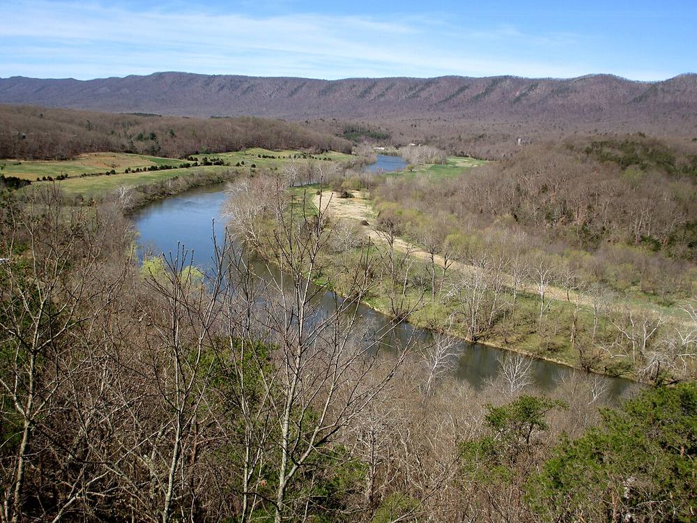 The South Fork of the Shenandoah River winding through a green valley with Massanutten Mountain behind