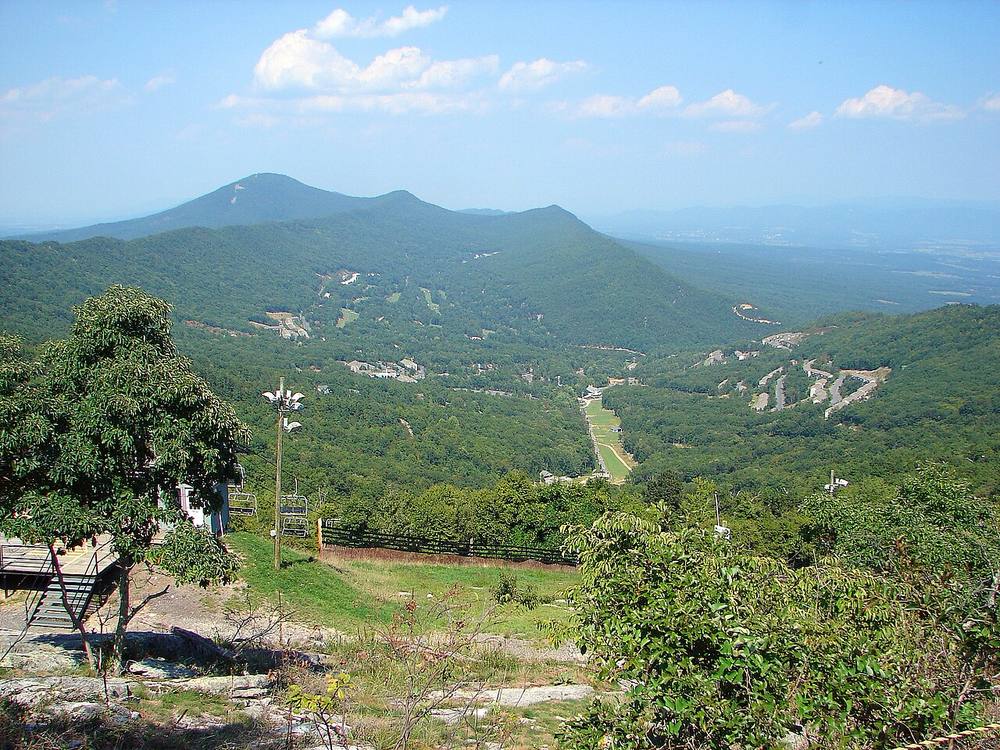 View over Massanutten Resort's ski slopes and village with the Blue Ridge Mountains in the distance