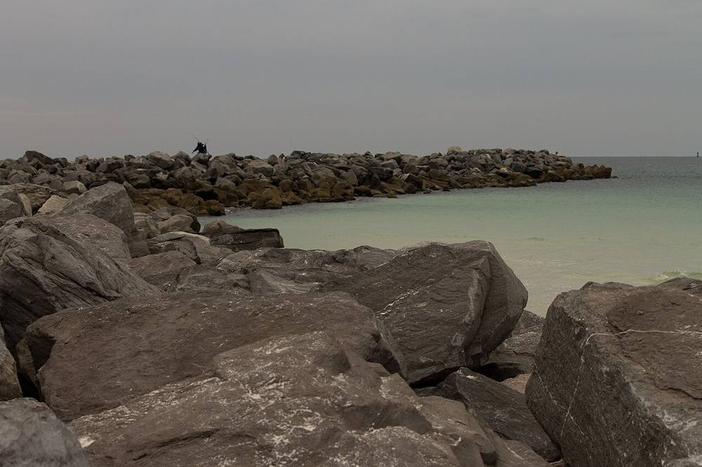 The jetty at St. Andrews State Park, Florida, looking south along the rocks into the Gulf